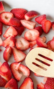 Cut strawberries in a 9x13 pan.