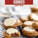A close-up of iced molasses cookies with sweet white icing on a cooling rack, one Molasses Cookie with a bite taken out; text at top reads “Iced Molasses Cookies.”.