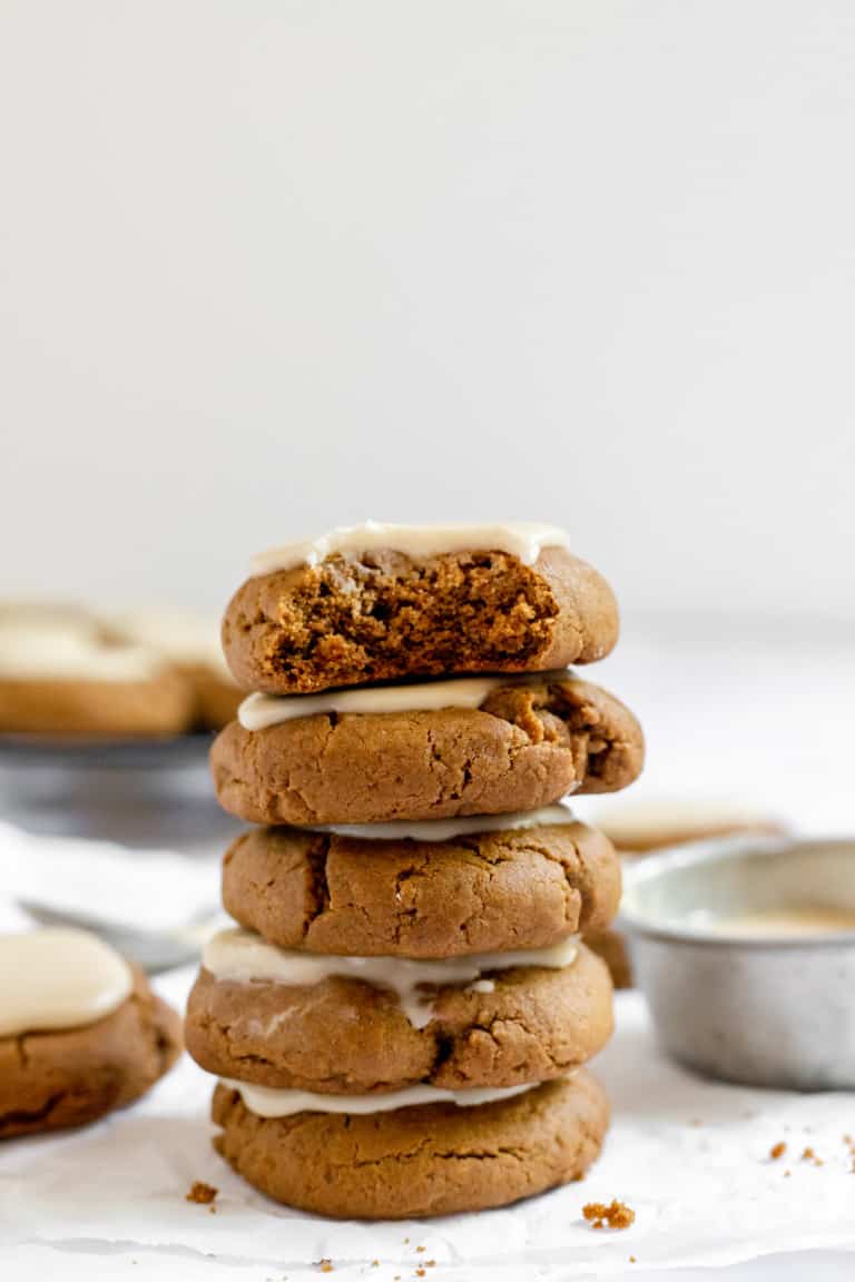 Stack of iced molasses cookies.