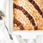 Sweet potato casserole with pecans and marshmallows.