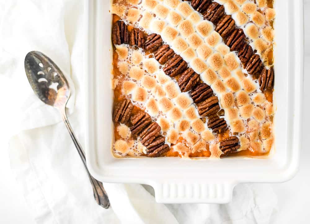 Sweet potato casserole with pecans and marshmallows.
