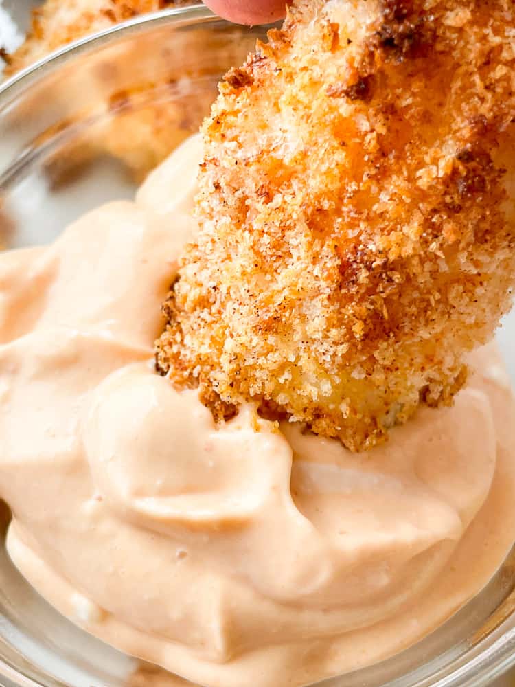 Dipping air fryer cod in spicy mayo. 
