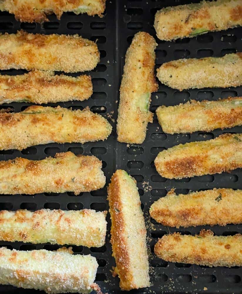 Zucchini Fries about halfway cooked in the air fryer.