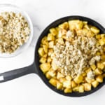 Fresh apples topped with crisp about to be baked.