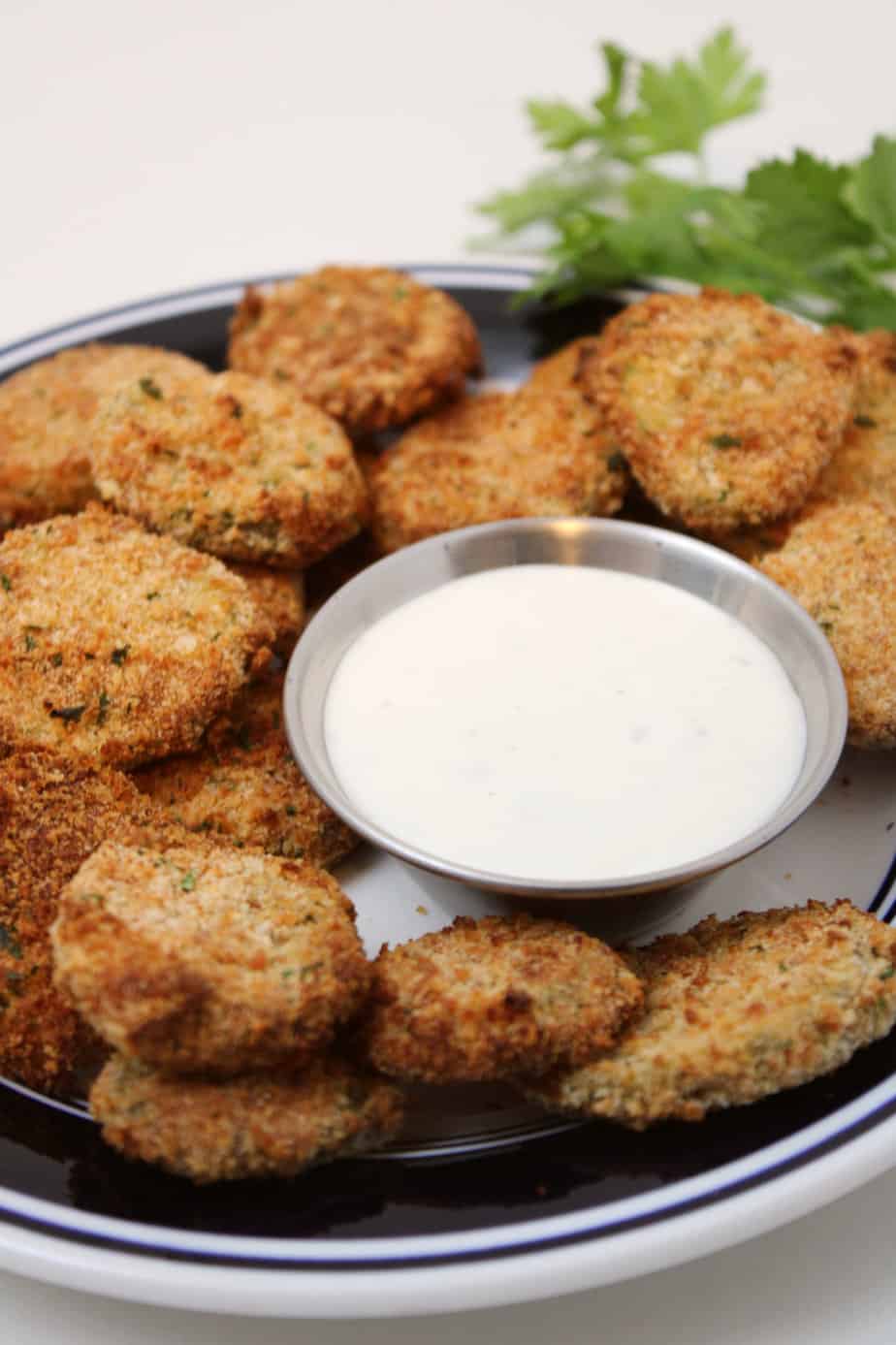 Crispy Air fryer Fried Pickles and dip on a platter.