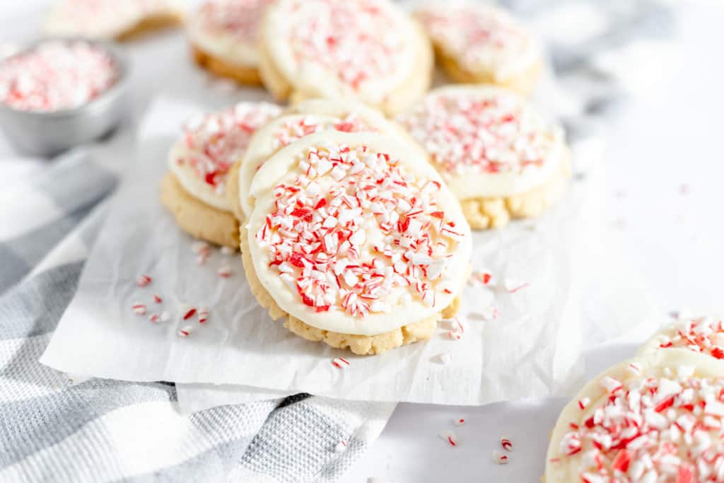 Peppermint Cookies topped with candy canes and frosting. 