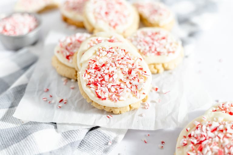 Peppermint Cookies topped with candy canes and frosting.