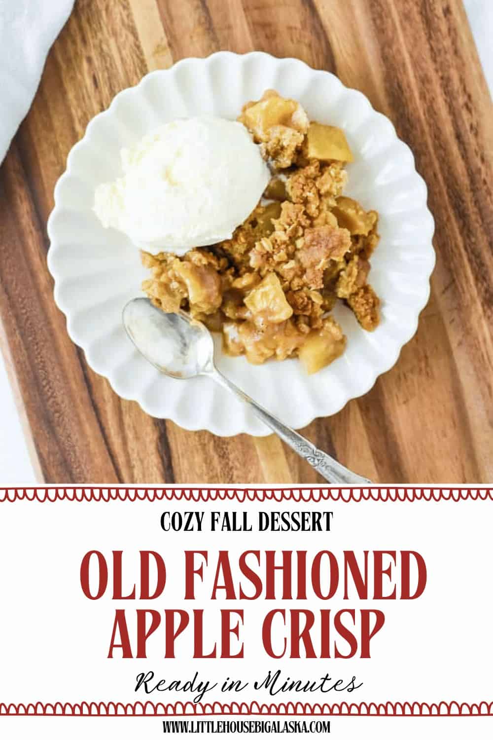 A plate with easy apple crisp and a scoop of vanilla ice cream sits on a wooden surface, next to a spoon. The text below reads: “Old Fashioned Apple Crisp, Ready in Minutes.”.