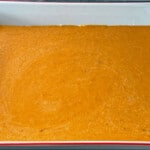 Pumpkin layer added to the baking dish.