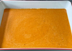Pumpkin layer added to the baking dish.