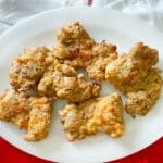 Air fryer fried chicken on a white platter.