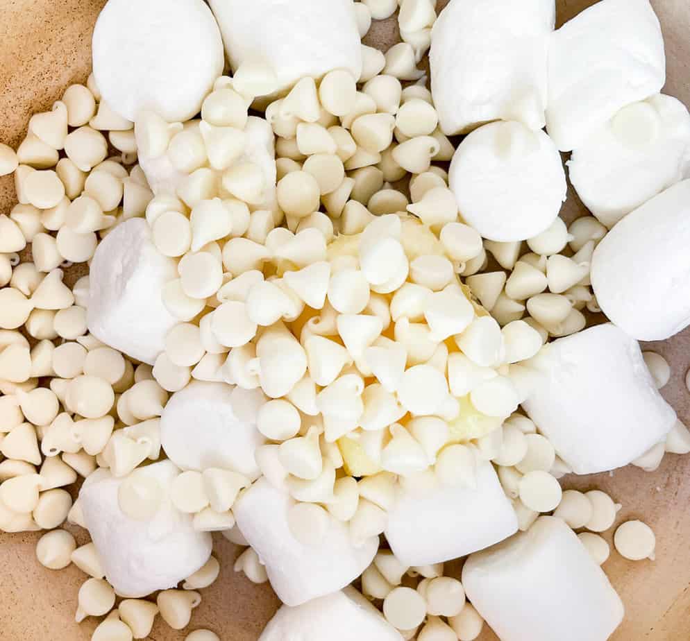 Butter, White Chocolate Chips, and Marshmallows in a pan to be melted together.