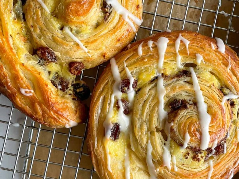 Rolls with tails made on parchment paper.