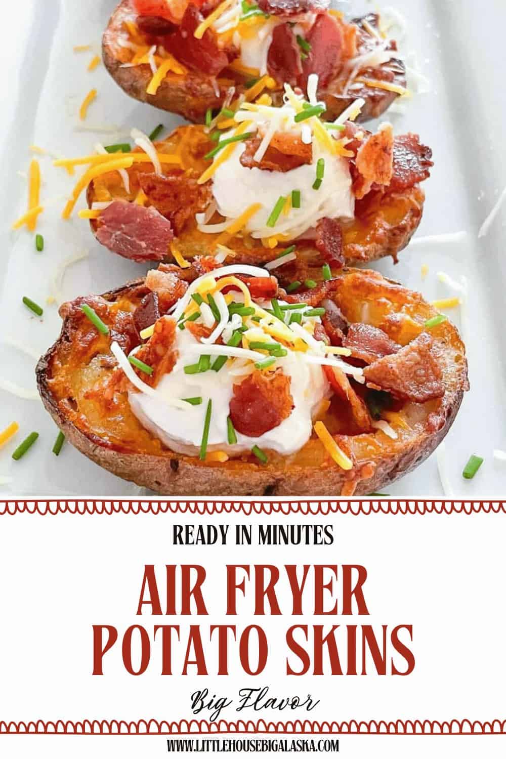 Three air fryer potato skins topped with sour cream, cheese, bacon pieces, and chopped chives are arranged on a white plate.