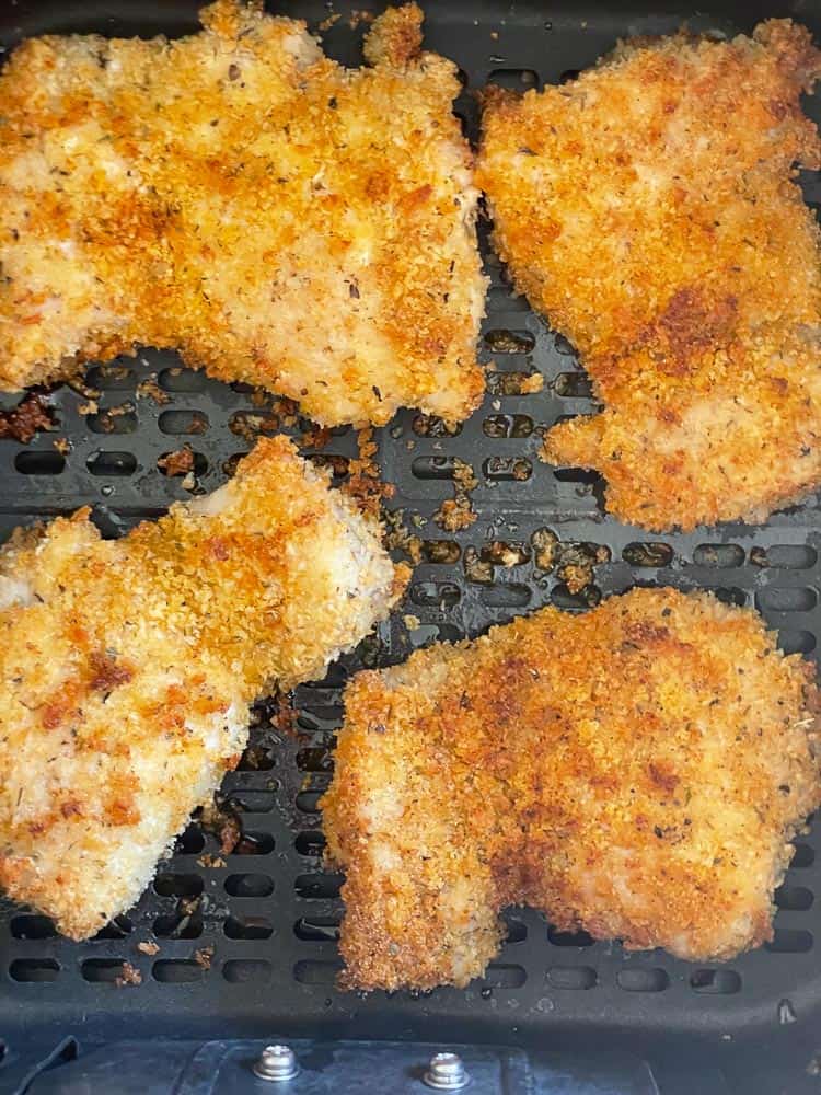 Crispy panko fried chicken in the air fryer basket.
