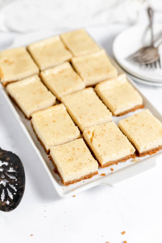 A full pan of eggnog cheesecake squares ready to serve.