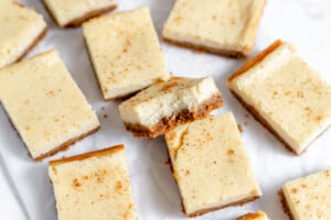 Eggnog cheesecake squares showing its layers.