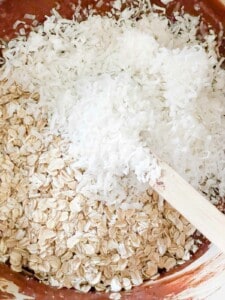 Coconut and rolled oats mixing in the no bake cookies.