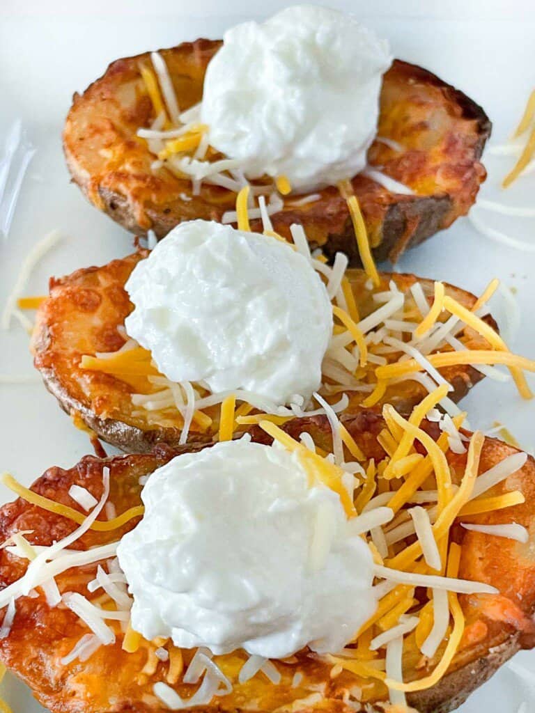 Stuffed potato skins with cheddar and sour cream. 