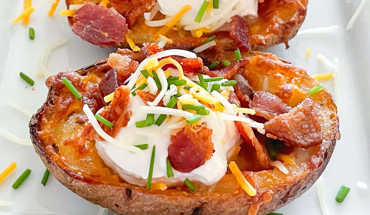 Crispy potato skins made in the air fryer on a platter.