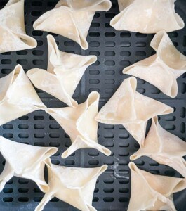 In the basket of a cosori air fryer.