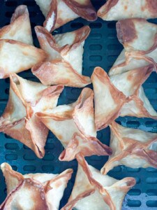 Air Fryer Crab Rangoon in the basket of a cosori.