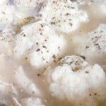 Fully cooked dumplings in chicken broth.