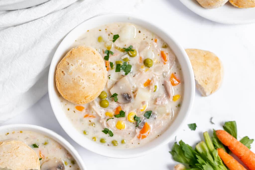 Creamy chicken soup, hearty and thick, in a bowl.