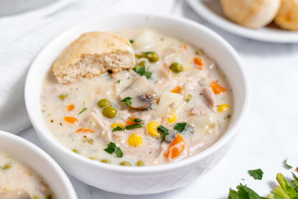 Thick and hearty chicken soup in a bowl.