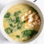 To the pot add chicken, gnocchi, and spinach.