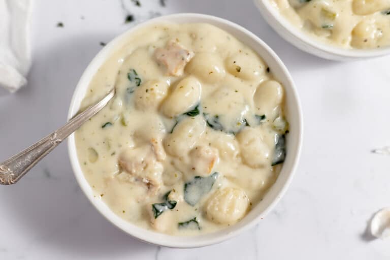 A bowl of chicken gnocchi soup.