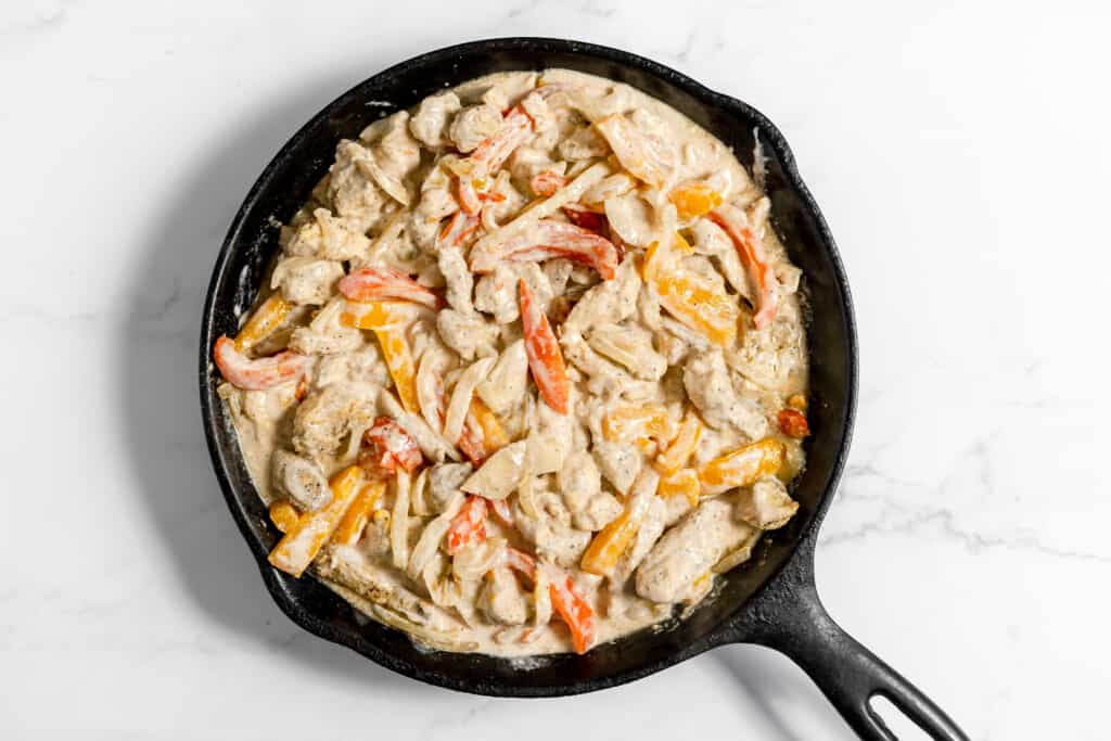 Stir the sour cream mix into the fajita skillet.