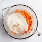 Add the dry ingredients to the carrot mixture.