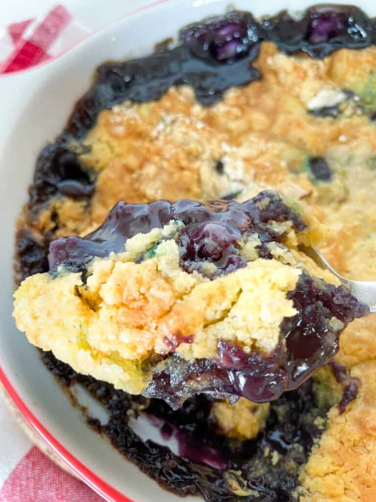 A scoop of blueberry dump cake.