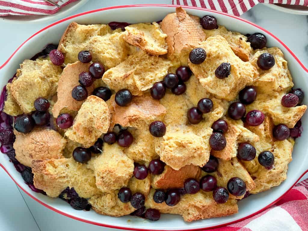Baked blueberry baked french toast with red accents.
