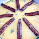 Sausages laid in a sunburts pattern.