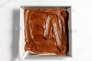 Brownie batter in an 8x8 pan.