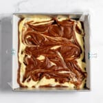 Swirled brownie batter with cheesecake bater.