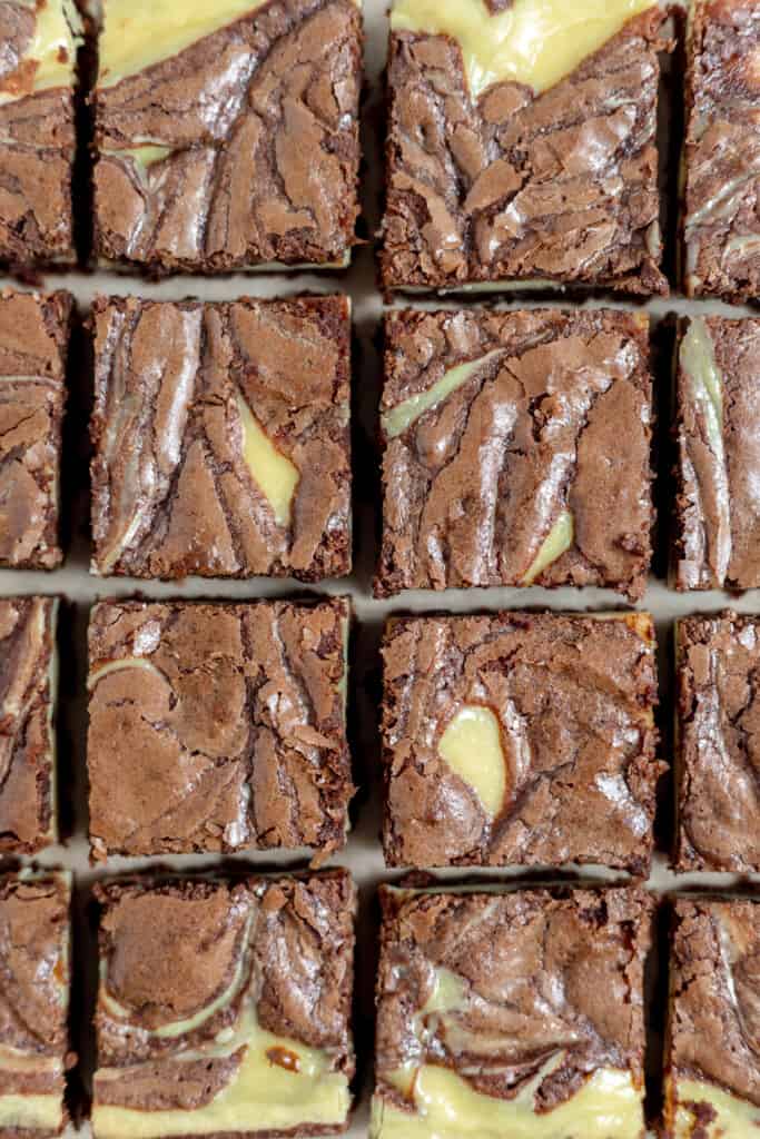Cut swirled cheesecake brownies. 