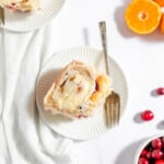 Top view of the best homemade orange rolls with cranberry sauce.