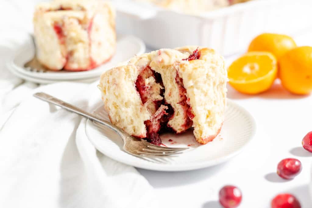 A sliced orange cranberry roll. 