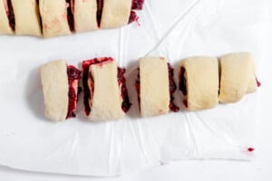 Sliced sweet rolls ready to go in a prepared pan.