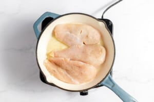 Browning chicken Breast in a skillet.