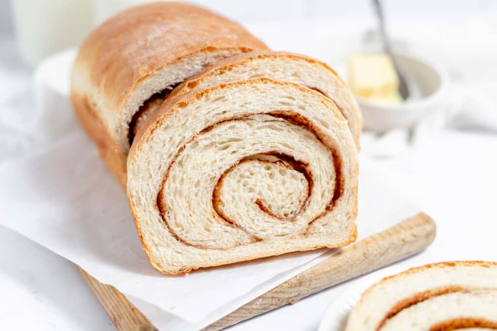 Sliced cinnamon bread showing its perfect swirl.