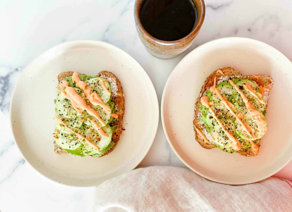 Two servings of sushi toast drizzled with spicy mayo served over with a cup of coffee.