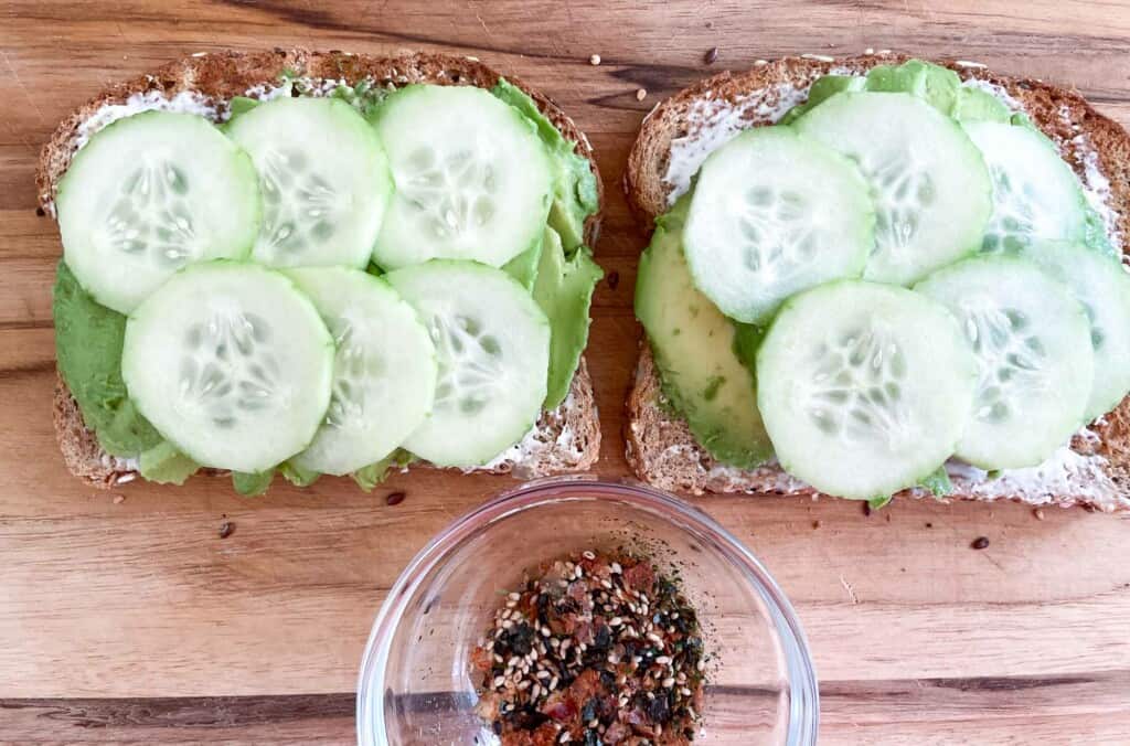 Furikake in a bowl and avocados and cucumbers on toast.