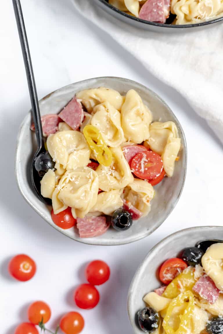 A bowl of tortellini salad.