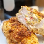 Close up of an air fryer stuffed chicken breast cut in half.