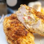 Stuffed chicken breast, one cut in half so you can see the inside.