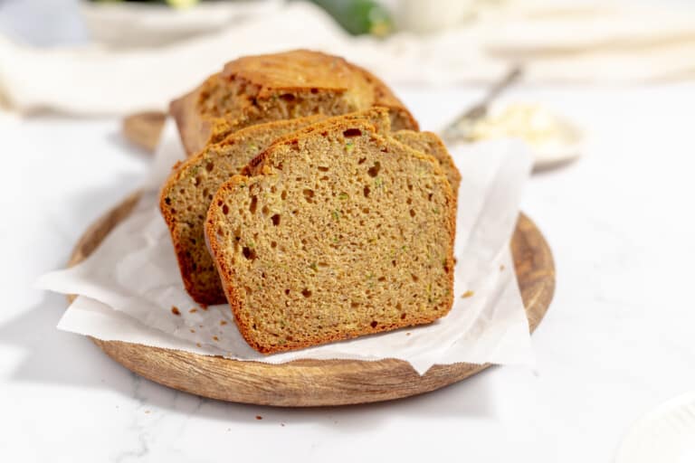 Zucchini banana bread in a wooden plate.